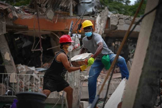 (260812) -- CALI, Aug. 12, 2026 -- Rescuers conduct search and rescue operations on the ruins of a building damaged in an earthquake in Cali, Colombia, Aug. 12, 2026. The death toll from Monday s 7.4-magnitude earthquake in western Colombia has risen to 241, with 3,771 others injured, Colombian media reported Wednesday, citing figures from the National Unit for Disaster Risk Management. (Photo by Xinhua) COLOMBIA-CALI-EARTHQUAKE-SEARCH AND RESCUE AndresxMoreno 