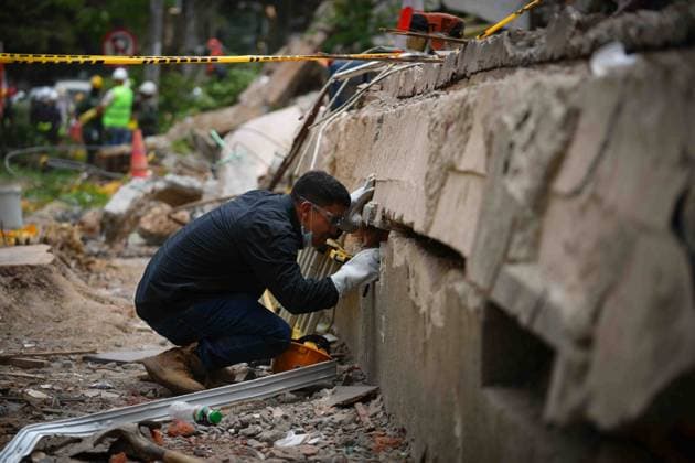 (260812) -- CALI, Aug. 12, 2026 -- A rescuer conducts search and rescue operations on the ruins of a building damaged in an earthquake in Cali, Colombia, Aug. 12, 2026. The death toll from Monday s 7.4-magnitude earthquake in western Colombia has risen to 241, with 3,771 others injured, Colombian media reported Wednesday, citing figures from the National Unit for Disaster Risk Management. (Photo by Xinhua) COLOMBIA-CALI-EARTHQUAKE-SEARCH AND RESCUE AndresxMoreno 