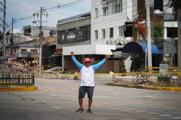 (260812) -- CALI, Aug. 12, 2026 -- A rescuer gestures for silence during search and rescue operations after an earthquake in Cali, Colombia, Aug. 12, 2026. The death toll from Monday s 7.4-magnitude earthquake in western Colombia has risen to 241, with 3,771 others injured, Colombian media reported Wednesday, citing figures from the National Unit for Disaster Risk Management. (Photo by Xinhua) COLOMBIA-CALI-EARTHQUAKE-SEARCH AND RESCUE AndresxMoreno 