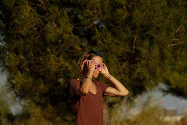 August 12, 2026, Madrid, Community Of Madrid, Spain: A massive crowd of astronomy enthusiasts and families gathers in the elevated grounds of the Parque Forestal de Valdebebas Felipe VI in Madrid, united by the anticipation of the first total solar eclipse visible from the Spanish mainland in 114 years. As the historic celestial event reaches its peak, the atmosphere in the park remains focused and disciplined; attendees are seen equipped with government-distributed, ISO 12312-2 certified solar glasses to safely observe the Sun s occlusion by the Moon. The choice of this expansive public park, with its unobstructed horizon and minimal urban light pollution, offers thousands of spectators a prime vantage point to witness the transition of da - ZUMAo127 20260812_zep_o127_087 Copyright: xHugoxOrtunox