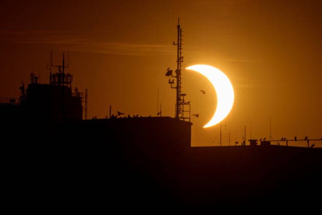 A partial solar eclipse appears over Germany. Germany - Kassel, 12.08.2026 A partial solar eclipse is seen over the rooftops of Kassel as the Moon passes in front of the Sun obscuring up to 89 percent when viewed from a central location in Germany. The total phase of the eclipse is visible only in parts of Greenland, Iceland and Spain, while Germany remains outside the path of totality. Hesse