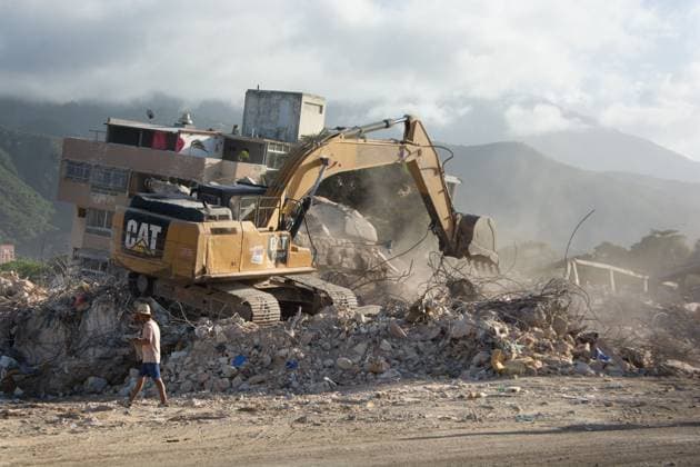 Recovery Efforts Continue in Earthquake-Ravaged La Guaira LA GUAIRA, VENEZUELA AUGUST 12, 2026: Residents continue moving through earthquake-damaged neighborhoods in Tanaguarena, Los Corales and Catia La Mar, where destroyed roads, collapsed buildings and debris continue to disrupt daily life 49 days after the twin earthquakes struck Venezuela s central coast. With public transportation limited, residents walk through rubble and around heavy machinery to reach different parts of the affected areas, while many continue searching for drinking water as recovery and debris removal operations remain underway. Estado la guaira Venezuela (Bolivarian Republic of) Copyright: x xFranyerxNievesx(Babel)x xJNAxPressx