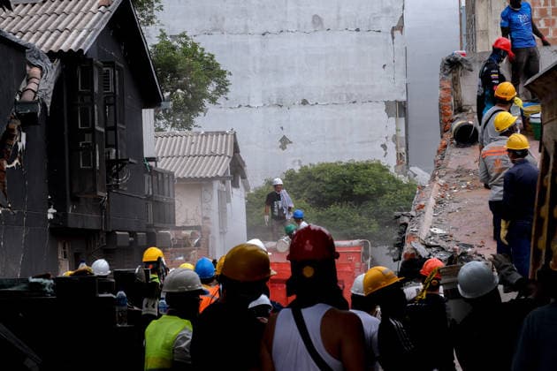 August 12, 2026, Cali, Valle Del Cauca, Colombia: People gather outside collapsed buildings in Cali, Colombia on August 12, 2026 to aid in several rescue labors after a 7,4 magnitude earthquake that struck the cities of Quibdo, Cali, Pereira and Manizales leaving more than 200 casualties past august 10. Cali Colombia - ZUMAvp1_ 20260812_zia_vp1_006 Copyright: xMartinxStevenxAngelx