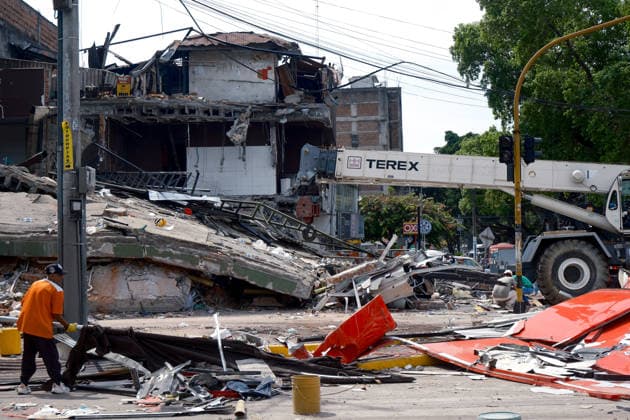 August 12, 2026, Cali, Valle Del Cauca, Colombia: People gather outside collapsed buildings in Cali, Colombia on August 12, 2026 to aid in several rescue labors after a 7,4 magnitude earthquake that struck the cities of Quibdo, Cali, Pereira and Manizales leaving more than 200 casualties past august 10. Cali Colombia - ZUMAvp1_ 20260812_zia_vp1_037 Copyright: xMartinxStevenxAngelx