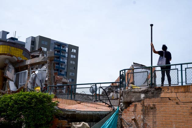 August 12, 2026, Cali, Valle Del Cauca, Colombia: People gather outside collapsed buildings in Cali, Colombia on August 12, 2026 to aid in several rescue labors after a 7,4 magnitude earthquake that struck the cities of Quibdo, Cali, Pereira and Manizales leaving more than 200 casualties past august 10. Cali Colombia - ZUMAvp1_ 20260812_zia_vp1_038 Copyright: xMartinxStevenxAngelx