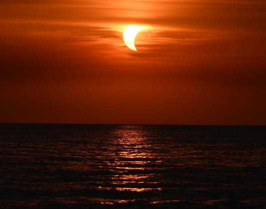 (260813) -- LADISPOLI, Aug. 13, 2026 -- This photo taken on Aug. 12, 2026 shows a partial solar eclipse over the sea in Ladispoli, Italy. (Photo by Xinhua) ITALY-LADISPOLI-PARTIAL SOLAR ECLIPSE AlbertoxLingria 