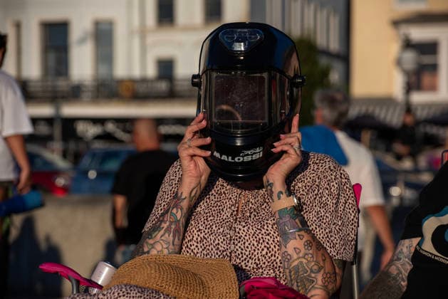 Solar Eclipse 2026 in Margate, UK - 12 AUG 2026. A woman seen enjoying the solar eclipse in her welding helmet. Hundreds of people gathered on the King s Steps to enjoy the partial solar eclipse in Margate, UK. Because of the Sun was covered by the Moon 90.6% on the maximum phase of the partial solar eclipse. Margate United Kingdom Copyright: xKrisztianxElekx xSOPAxImagesx SSS_20260812_SOLAR_ECLIPSE_0011005020