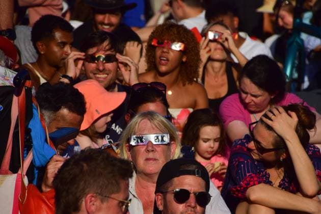Partial Solar Eclipse in London, UK - 12 Aug 2026 Thousands of people, some wearing solar eclipse glasses, pack Primrose Hill to watch the partial solar eclipse. Approximately 91 percent of the sun was obscured by the moon. London United Kingdom Copyright: xVukxValcicx xSOPAxImagesx Vuk-Valcic-1441796