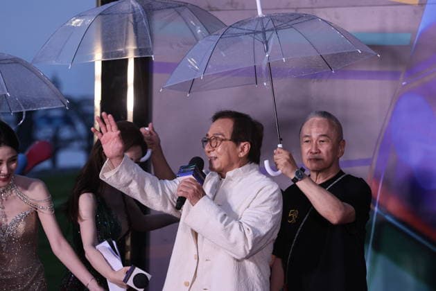 HARBIN, CHINA - AUGUST 12: Director Teddy Chan holds an umbrella for actor Jackie Chan on the red carpet during the closing ceremony of the 7th Jackie Chan International Action Film Week on August 12, 2026 in Harbin, Heilongjiang Province of China. The event brings together hundreds of filmmakers to celebrate action cinema.  Copyright: xVCGx 111659586557
