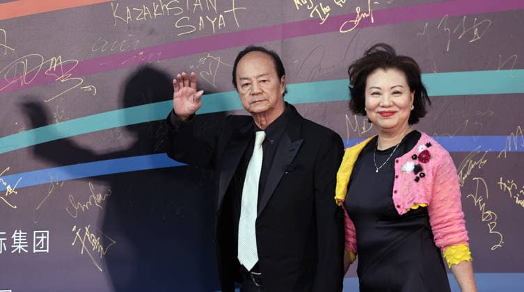 HARBIN, CHINA - AUGUST 12: Actor Ti Lung and his wife attend the red carpet of the closing ceremony for the 7th Jackie Chan International Action Film Week on August 12, 2026 in Harbin, Heilongjiang Province of China. The event was held at Harbin Ice-Snow World.  Copyright: xVCGx 111659586589