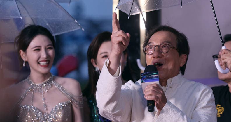 HARBIN, CHINA - AUGUST 12: Director Chen Deshen holds an umbrella for actor Jackie Chan on the red carpet during the closing ceremony of the 7th Jackie Chan International Action Film Week on August 12, 2026 in Harbin, Heilongjiang Province of China.  Copyright: xVCGx 111659586563