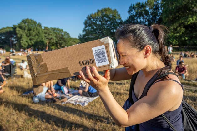 Solar Eclipse Over Hampstead Heath London, 2026 Visitors gathered at Hampstead Heath in North London to watch the solar eclipse. The eclipse was visible across the London skyline, with spectators looking towards the sky and capturing the event on cameras and phones., Credit:Zak Irfan Avalon  Copyright: xZakxIrfanx xAvalonx 1122596900