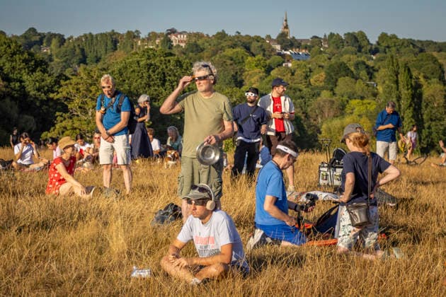 Solar Eclipse Over Hampstead Heath London, 2026 Visitors gathered at Hampstead Heath in North London to watch the solar eclipse. The eclipse was visible across the London skyline, with spectators looking towards the sky and capturing the event on cameras and phones., Credit:Zak Irfan Avalon  Copyright: xZakxIrfanx xAvalonx 1122596915