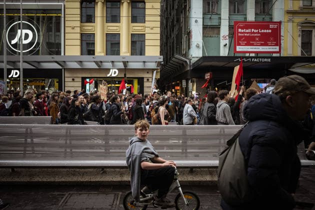ONE NATION STUDENT PROTEST, A young man rides a tiny bicycle along as thousands expressed their displeasure at the rise of the One Nation Party during a rally of high school and university students opposed to the policies of Pauline Hanson and One Nation at State Library Victoria in Melbourne, Thursday, August 13, 2026. ( NO ARCHIVING Melbourne Victoria AUSTRALIA  Copyright: xCHRISTOPHERxHOPKINSx 20260813136377516575