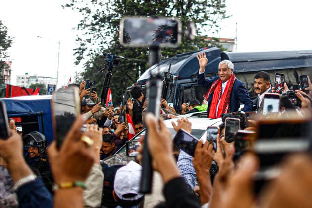 August 13, 2027, Kathmandu, Nepal: Former Prime Minister Sher Bahadur Deuba arrives at Tribhuvan International Airport after nearly six months abroad for medical treatment, in Kathmandu, Nepal, on Thursday, August 13, 2026. Deuba, who left Nepal for Singapore in February and later travelled to Hong Kong, returned amid heightened political attention following a money-laundering investigation involving the Deuba family. Thousands of Nepali Congress supporters gathered at the airport to welcome the veteran leader. Kathmandu Nepal - ZUMAg200 20270813_zap_g200_001 Copyright: xSkandaxGautamx