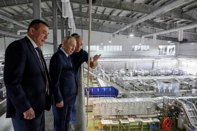 RUSSIA, SAKHALIN REGION - AUGUST 13, 2026: Alexander Verkhovsky, President of Gidrostroy, accompanies Vladimir Putin, President of Russia, and Valery Limarenko (R-L), Sakhalin Region Governor, on their visit to the Yasny Clear fish processing plant owned by Gidrostroy and situated on Iturup Island. Gavriil Grigorov Russian Presidential Press and Information Office TASS  96092474