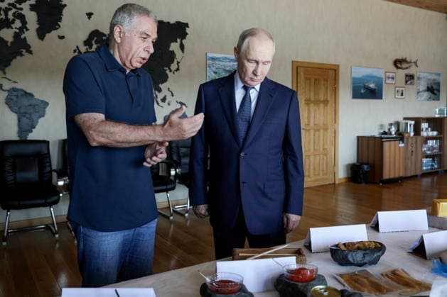 RUSSIA, SAKHALIN REGION - AUGUST 13, 2026: Alexander Verkhovsky (L), President of Gidrostroy, accompanies Vladimir Putin, President of Russia, on his visit to the Yasny Clear fish processing plant owned by Gidrostroy and situated on Iturup Island. Gavriil Grigorov Russian Presidential Press and Information Office TASS  96092645