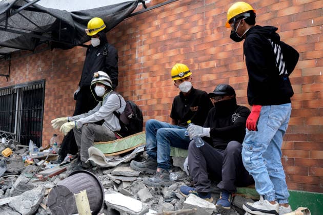 Coiombia Earthquake Aftermath People gather outside collapsed buildings in Cali, Colombia on August 12, 2026 to aid in several rescue labors after a 7,4 magnitude earthquake that struck the cities of Quibdo, Cali, Pereira and Manizales leaving more than 200 casualties past august 10. Cali Valle del Cauca Colombia Copyright: xMartinxStevenxAngelx
