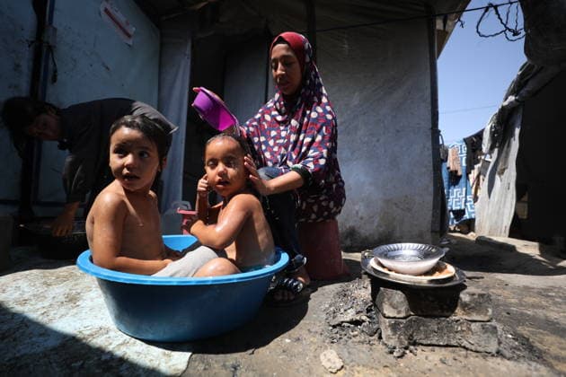 Displaced Palestinian Families Endure Summer Heat in Nuseirat Displaced Palestinian families live in tents in Nuseirat refugee camp in the central Gaza Strip, on August 13, 2026, as they struggle to cope with high temperatures and summer heat amid difficult living conditions. Photo by Hassan al-Jedi apaimages Nusairat Gaza Strip Palestinian Territory 130826_Nuseirat_HJ_00(28).jpeg Copyright: xapaimagesxHassanxal-Jedixx xapaimagesx