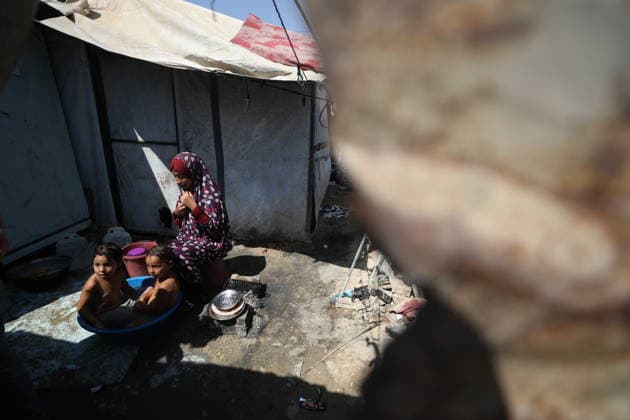 Displaced Palestinian Families Endure Summer Heat in Nuseirat Displaced Palestinian families live in tents in Nuseirat refugee camp in the central Gaza Strip, on August 13, 2026, as they struggle to cope with high temperatures and summer heat amid difficult living conditions. Photo by Hassan al-Jedi apaimages Nusairat Gaza Strip Palestinian Territory 130826_Nuseirat_HJ_00(32).jpeg Copyright: xapaimagesxHassanxal-Jedixx xapaimagesx