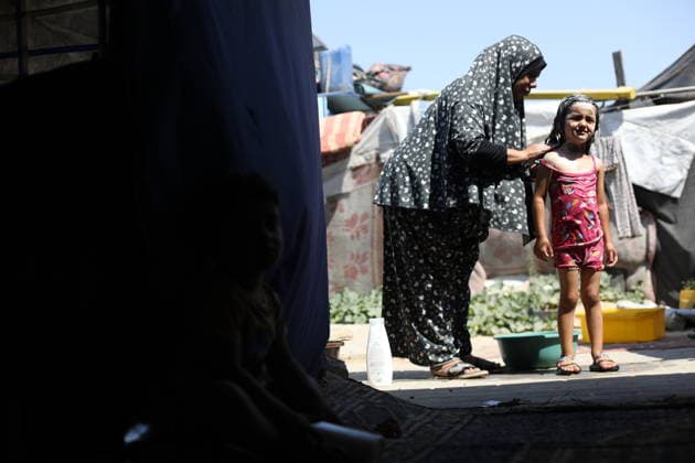 Displaced Palestinian Families Endure Summer Heat in Nuseirat Displaced Palestinian families live in tents in Nuseirat refugee camp in the central Gaza Strip, on August 13, 2026, as they struggle to cope with high temperatures and summer heat amid difficult living conditions. Photo by Hassan al-Jedi apaimages Nusairat Gaza Strip Palestinian Territory 130826_Nuseirat_HJ_00(36).jpeg Copyright: xapaimagesxHassanxal-Jedixx xapaimagesx
