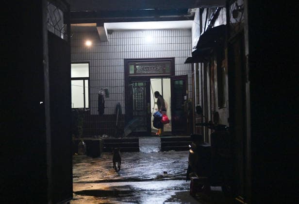(260813) -- LUOHE, Aug. 13, 2026 -- Residents prepare to be evacuated to a temporary shelter in Beiwudu Town of Wuyang County, Luohe, central China s Henan Province, Aug. 13, 2026. Thousands of people have been evacuated in central China s Henan Province after days of torrential rain swelled rivers and triggered a levee breach, local authorities said Thursday. In Luohe City, more than 4,500 people from 10 villages were evacuated amid rising concerns over potential river flooding. From Monday afternoon to Wednesday afternoon, the city recorded an average rainfall of 270.1 millimeters, with a peak of 434.2 millimeters, prompting authorities to activate the highest-level flood control emergency response. ) CHINA-HENAN-LUOHE-TYPHOON DOLPHI 