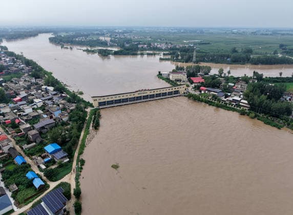 (260813) -- LUOHE, Aug. 13, 2026 -- An aerial drone photo taken on Aug. 13, 2026 shows a flood discharge scene at the Nihewa flood storage and detention area in Wuyang County of Luohe City, central China s Henan Province. Affected by Typhoon Dolphin, the 13th typhoon of the year, the Shaying River has recorded a flow rate exceeding 3,000 cubic meters per second in its Luohe section, while the water level continues to rise. In accordance with relevant contingency plans, Henan Province activated the Nihewa flood storage and detention area on Thursday. ) CHINA-HENAN-LUOHE-TYPHOON DOLPHIN-FLOOD STORAGE AREA (CN) HaoxYuan 
