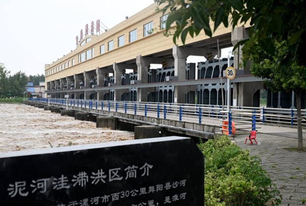 (260813) -- LUOHE, Aug. 13, 2026 -- This photo taken on Aug. 13, 2026 shows a flood discharge scene at the Nihewa flood storage and detention area in Wuyang County of Luohe City, central China s Henan Province. Affected by Typhoon Dolphin, the 13th typhoon of the year, the Shaying River has recorded a flow rate exceeding 3,000 cubic meters per second in its Luohe section, while the water level continues to rise. In accordance with relevant contingency plans, Henan Province activated the Nihewa flood storage and detention area on Thursday. ) CHINA-HENAN-LUOHE-TYPHOON DOLPHIN-FLOOD STORAGE AREA (CN) HaoxYuan 