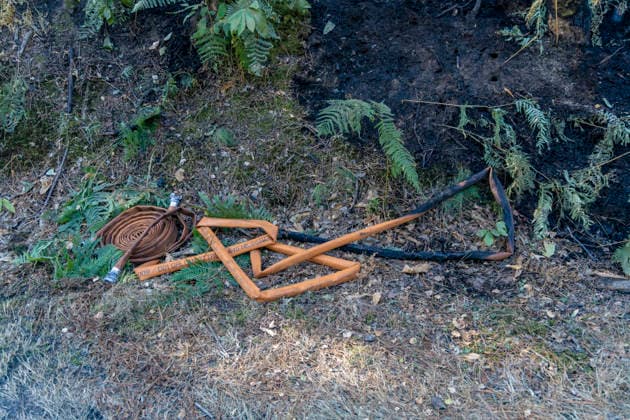 Forest Fire Aftermath In Saint-Just - France A burned firefighting hose lies on the ground during a forest fire in the Saint-Just area of Ille-et-Vilaine, France on August 13, 2026, as emergency crews battle the blaze. Photo by La Tuque Jaune ANDBZ ABACAPRESS.COM Saint-Just Ille-et-Vilaine France  Copyright: xANDBZ ABACAx