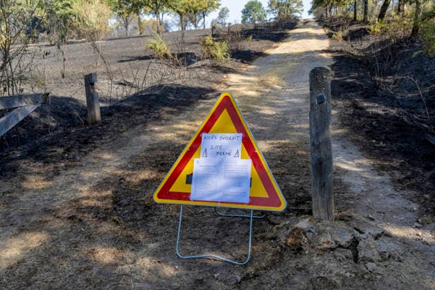Forest Fire Aftermath In Saint-Just - France A no access sign is posted near a closed site during a forest fire in the Saint-Just area of Ille-et-Vilaine, France on August 13, 2026, as emergency crews battle the blaze. Photo by La Tuque Jaune ANDBZ ABACAPRESS.COM Saint-Just Ille-et-Vilaine France  Copyright: xANDBZ ABACAx