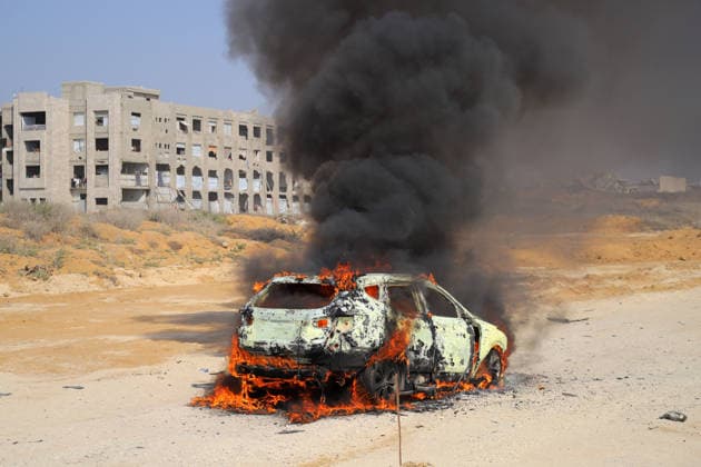 Palestinians Extinguish Vehicle Fire After Israeli Strike in Gaza City Palestinian Civil Defense members and displaced Palestinians work to extinguish a fire in a car following an Israeli strike on Al-Rashid Street, southwest of Gaza City, Gaza Strip, on August 13, 2026. Local sources said Jamal Abu Kamil, director of the Gaza Governorate police, was killed when his car was targeted in the Sheikh Ajleen neighborhood of southwest Gaza City. Photo by Ahmed Ibrahim apaimages Deir al-Balah Gaza Palestinian Territory 130826_Gaza_AI_00(36) Copyright: xapaimagesxAhmedxIbrahimx xapaimagesx