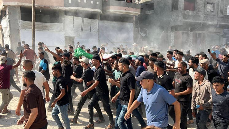 Mourners carry the body of Huthaifa Kawara during his funeral at Nasser Hospital in Khan Younis, Gaza, Palestine, on August 13, 2026. Kawara, a field commander of the Izz al-Din al-Qassam Brigades, Hamas s military wing, was killed in an Israeli airstrike in Khan Younis. Israel also assassinated the Gaza City police chief.  GAZ2026081305 SaidxAbid