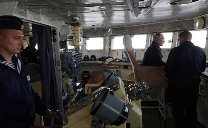 August 13, 2026, Korsakov, Sakhalin Oblast, Russia: Russian President Vladimir Putin, listens to Pacific Fleet Commander-in-Chief Admiral Viktor Liina, right, as they watch the Pacific Fleet naval exercises from the bridge of the Russian Navy Slava-class missile cruiser RF Varyag, August 12, 2026 off the coast of Sakhalin Island, Russia. Korsakov Russia - ZUMAp138 20260813_zaa_p138_005 Copyright: xGavriilxGrigorov RussianxGovernmx