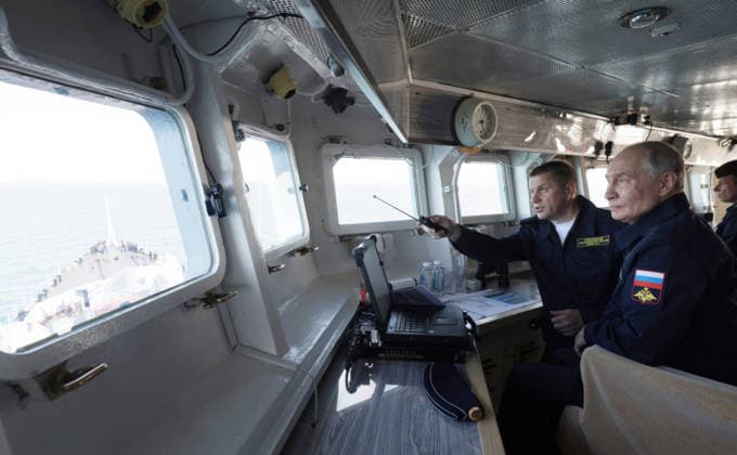 August 13, 2026, Korsakov, Sakhalin Oblast, Russia: Russian President Vladimir Putin, listens to Pacific Fleet Commander-in-Chief Admiral Viktor Liina, left, as they watch the Pacific Fleet naval exercises from the bridge of the Russian Navy Slava-class missile cruiser RF Varyag, August 12, 2026 off the coast of Sakhalin Island, Russia. Korsakov Russia - ZUMAp138 20260813_zaa_p138_013 Copyright: xGavriilxGrigorov RussianxGovernmx
