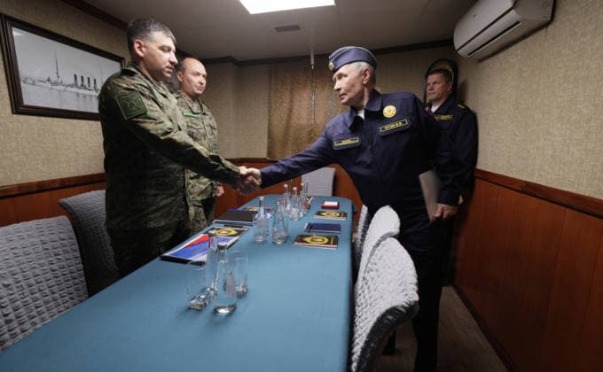 August 13, 2026, Korsakov, Sakhalin Oblast, Russia: Russian President Vladimir Putin, greets participants in a meeting on border security for the Far East, aboard the Russian Navy Slava-class missile cruiser RF Varyag, August 13, 2026 off the coast of Sakhalin Island, Russia. standing from left: Sakhalin Region FSB Border Guard Service Head Sergey Makhorin, 68th Guards Army Corps Acting Commander Alexey Shvedov, Putin, and Pacific Fleet Commander-in-Chief Admiral Viktor Liina. Korsakov Russia - ZUMAp138 20260813_zaa_p138_016 Copyright: xGavriilxGrigorov RussianxGovernmx