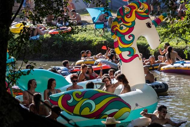 August 13, 2026, Paredes De Coura, Braga, Portugal: Festivalgoers gather on inflatable rafts at the river Coura known locally as Couraiso during the daytime at Vodafone Paredes de Coura. Paredes De Coura Portugal - ZUMAs197 20260813_aab_s197_020 Copyright: xDiogoxBaptistax