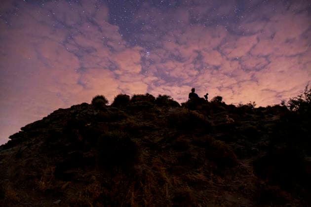 Perseid Meteor Shower Over Izmir Silhouettes of skywatchers stand on a rocky ridge beneath a partly cloudy, star-filled sky near Sarpincik Lighthouse in Karaburun district of Izmir, Turkey, on August 13, 2026. The annual Perseid meteor shower, produced as Earth passes through debris left by comet Swift-Tuttle, peaked overnight from August 12 into the early hours of August 13, drawing skywatchers to dark viewing points to observe one of the year™s best-known meteor displays. Izmir Izmir Turkey Copyright: xMuratxKocabasx