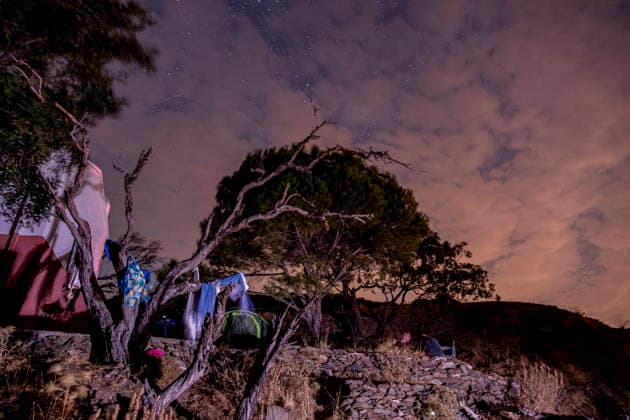 Perseid Meteor Shower Over Izmir Clothing and other items hang from tree branches beneath a partly cloudy, star-filled sky near Sarpincik Lighthouse in Karaburun district of Izmir, Turkey, on August 13, 2026. The annual Perseid meteor shower, produced as Earth passes through debris left by comet Swift-Tuttle, peaked overnight from August 12 into the early hours of August 13, drawing skywatchers to dark viewing points to observe one of the year™s best-known meteor displays. Izmir Izmir Turkey Copyright: xMuratxKocabasx
