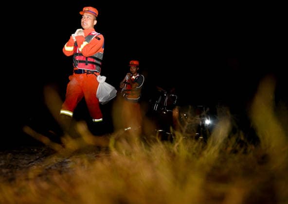 (260814) -- JIAXIAN, Aug. 14, 2026 -- Rescuers work at the site of a levee breach along the Beiru River in Jiaxian County, central China s Henan Province, Aug. 13, 2026. A levee along the Beiru River in Jiaxian County gave way on Wednesday night, following extreme rainfall and large-volume discharges from upstream reservoirs. As of Thursday, a total of 2,182 people had been evacuated to safety, with no casualties reported so far. Efforts to contain the levee breach are underway. ) CHINA-HENAN-JIAXIAN COUNTY-LEVEE BREACH-REPAIR WORK (CN) HaoxYuan 