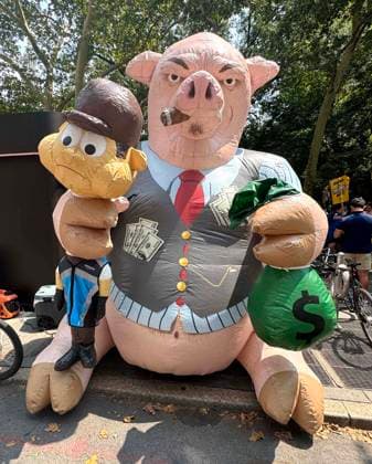 August 13, 2026, New York, New York, USA: An inflatable Greedy Pig seen near the Amazon Teamsters and Allies picket outside of City Hall for passage of the Delivery Protection Act. The Delivery Protection Act would require companies like Amazon to hire its workforce directly, essentially making Amazons corrupt third-party Delivery Service Partner model illegal in New York City. New York USA - ZUMAk03_ 20260813_zaf_k03_073 Copyright: xNancyxKaszermanx
