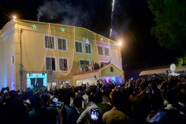 Pakistan Independence Day Celebrations Rawalpindi A crowd gathers outside an illuminated building as fireworks are launched during Independence Day celebrations in Rawalpindi, Pakistan, on August 14, 2026. Pakistan marks Independence Day on August 14, commemorating the countryis independence from British rule in 1947. Rawalpindi Punjab Pakistan Copyright: xZubairxAbbasix