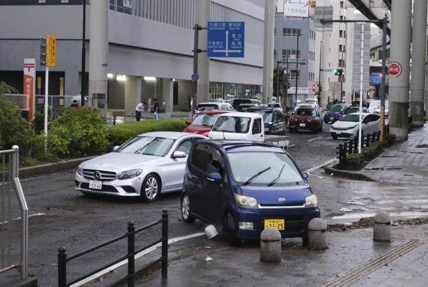 Aftermath of torrential rain in eastern Japan Abandoned vehicles stranded by heavy rain are seen on a road in Chiba, east of Tokyo, on Aug. 14, 2026, after torrential rain overnight. Japan s weather agency issued its highest Level 5 warning for downpours in parts of Chiba Prefecture.  A14AA0005625742P