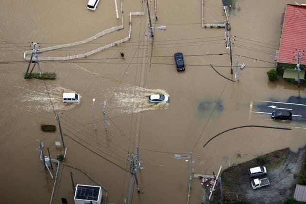 Aftermath of torrential rain in eastern Japan Photo taken from a Kyodo News helicopter on Aug. 14, 2026, shows a vehicle making its way on a flooded road in Oamishirasato in Chiba Prefecture, east of Tokyo, after torrential rain overnight. Japan s weather agency issued its highest Level 5 warning for downpours in parts of the prefecture.  A14AA0005625746P