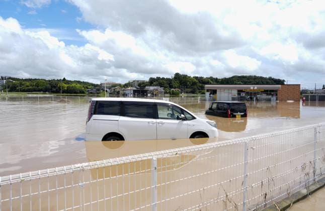 Aftermath of torrential rain in eastern Japan Vehicles are seen submerged in floodwater in Oamishirasato in Chiba Prefecture, east of Tokyo, on Aug. 14, 2026, after torrential rain overnight. Japan s weather agency issued its highest Level 5 warning in parts of the prefecture.  A14AA0005625752P