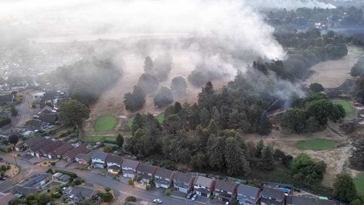 August 14, 2026, Stourbridge, West Midlands, UK: Stourbridge, UK. The fire still burns on Golf Course in the Stourbridge area of Birmingham, West Midlands, after fires broke out yesterday afternoon in record temperatures. The UK experienced its hottest day of the year on Thursday, with a peak of 38.1 degrees celsius recorded at Kew Gardens. Stourbridge UK  - ZUMAl94_ 20260814_zaf_l94_007 Copyright: xIoannisxAlexopoulosx