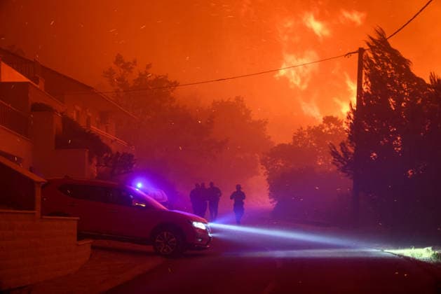 (260814) -- OMIS, Aug. 14, 2026 -- Firefighters are pictured near a massive wildfire at the coastal town of Omis, Croatia, on Aug. 13, 2026. At least 1,000 residents and tourists have been evacuated after a massive wildfire spread into the coastal town of Omis in southern Croatia, local media reported early Friday. ( PIXSELL via Xinhua) CROATIA-OMIS-WILDFIRE ZvonimirxBarisin 