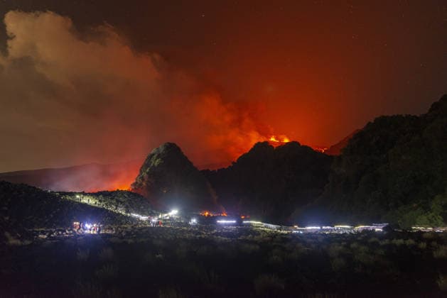 Mount Etna s eruptive activity continues CATANIA, ITALY - AUGUST 14: Mount Etna s eruptive activity continues, with active lava flows fed by vents located at 2,750 and 1,900 meters of altitude, alongside ongoing ash emissions from the Voragine summit crater in Catania, Sicily, Italy on August 14, 2026. The spectacular glowing lava streams have attracted an exceptional influx of hikers, tourists, and curious onlookers eager to witness the volcanic phenomenon at night. In response to this dangerous mass exodus towards the active lava fronts, local authorities have implemented strict roadblocks, parking bans along key mountain routes like the Mareneve road, and restricted access to the affected areas to ensure public safety. Meanwhile, the con  Copyright: x2026xAnadoluxSalvatorexAllegrax