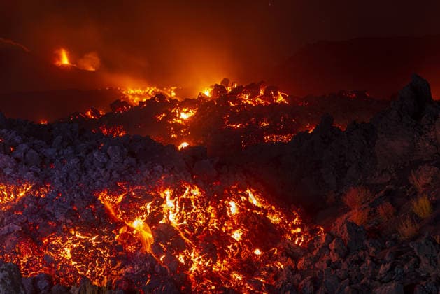 Mount Etna s eruptive activity continues CATANIA, ITALY - AUGUST 14: Mount Etna s eruptive activity continues, with active lava flows fed by vents located at 2,750 and 1,900 meters of altitude, alongside ongoing ash emissions from the Voragine summit crater in Catania, Sicily, Italy on August 14, 2026. The spectacular glowing lava streams have attracted an exceptional influx of hikers, tourists, and curious onlookers eager to witness the volcanic phenomenon at night. In response to this dangerous mass exodus towards the active lava fronts, local authorities have implemented strict roadblocks, parking bans along key mountain routes like the Mareneve road, and restricted access to the affected areas to ensure public safety. Meanwhile, the con  Copyright: x2026xAnadoluxSalvatorexAllegrax