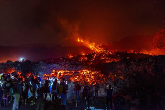 Mount Etna s eruptive activity continues CATANIA, ITALY - AUGUST 14: Mount Etna s eruptive activity continues, with active lava flows fed by vents located at 2,750 and 1,900 meters of altitude, alongside ongoing ash emissions from the Voragine summit crater in Catania, Sicily, Italy on August 14, 2026. The spectacular glowing lava streams have attracted an exceptional influx of hikers, tourists, and curious onlookers eager to witness the volcanic phenomenon at night. In response to this dangerous mass exodus towards the active lava fronts, local authorities have implemented strict roadblocks, parking bans along key mountain routes like the Mareneve road, and restricted access to the affected areas to ensure public safety. Meanwhile, the con  Copyright: x2026xAnadoluxSalvatorexAllegrax
