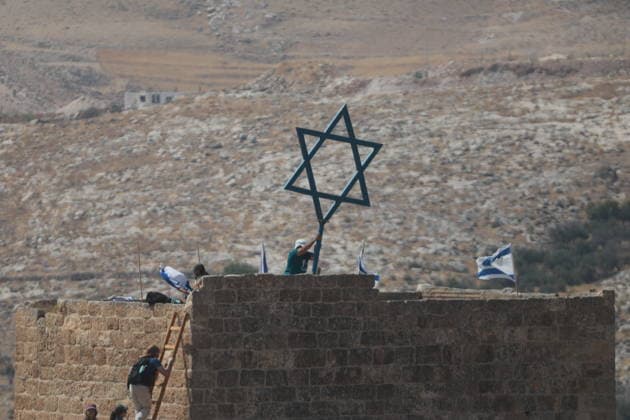 Israeli violations against Palestinians continue HEBRON, WEST BANK, PALESTINE - AUGUST 14: Palestinians and foreign activists gather to protest in support of their land, which they say is under threat of being seized by Israelis, and to express their determination not to leave their properties in Beit Sahour, Hebron Governorate, West Bank, on August 14, 2026. Armed Israelis who came to the area intervened and attempted to disperse the group. Mamoun Wazwaz Anadolu Hebron West Bank. Editorial use only. Please get in touch for any other usage.  Copyright: x2026xAnadoluxMamounxWazwazx